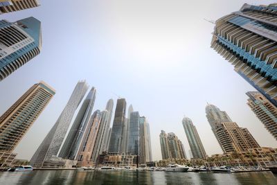 Modern buildings in city against clear sky