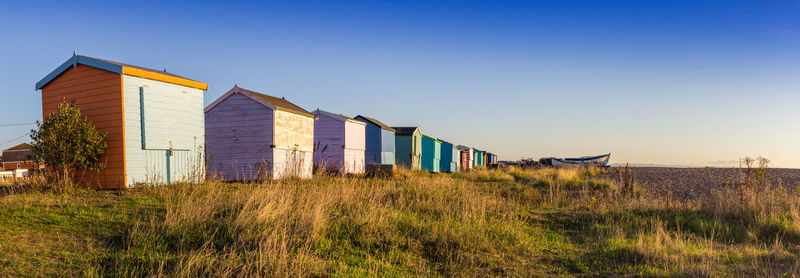 Barn on field against clear sky