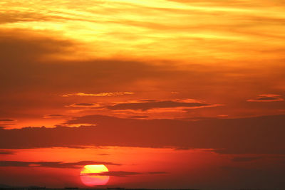 Scenic view of dramatic sky during sunset