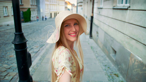 Portrait of young woman standing outdoors