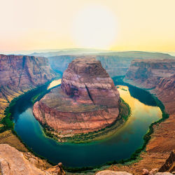 High angle view of horseshoe bend against clear sky during sunset