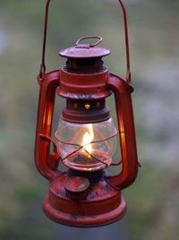 Close-up of illuminated lantern hanging against blurred background