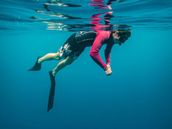 Man swimming undersea