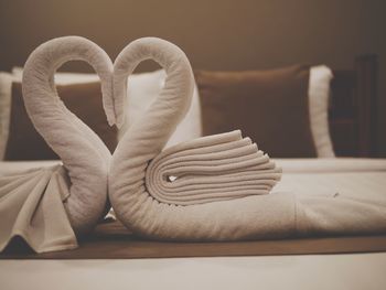 Close-up of heart shape on sofa at home