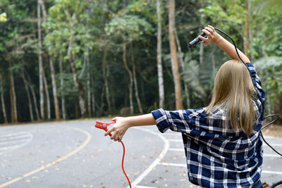 Woman photographing with mobile phone