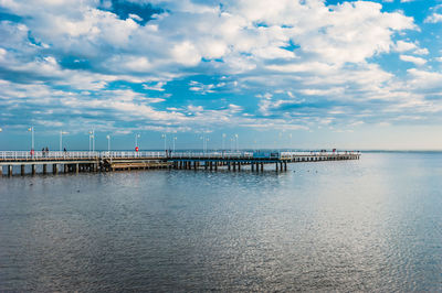 Pier over sea against sky