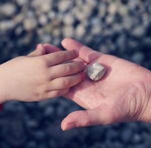 Close-up of hand holding hands