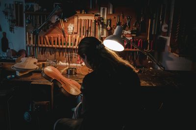 Rear view of woman working