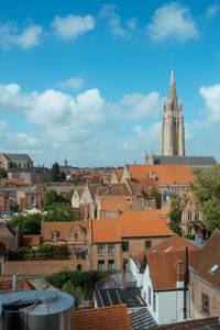 Buildings in town against sky