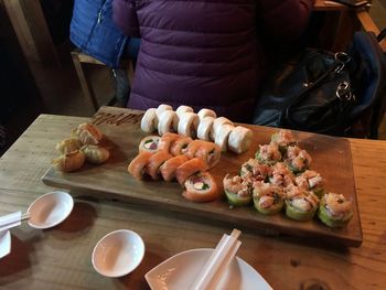 High angle view of man preparing food on table