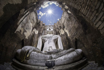 Low angle view of statue against building