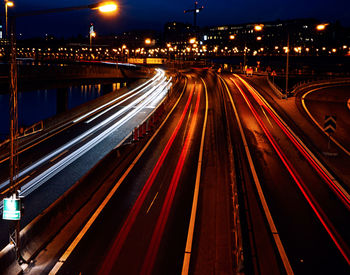 High angle view of light trails on highway at night