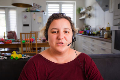 Portrait of woman talking on video call at home