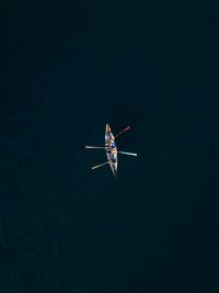 Aerial view of people on boat in lake