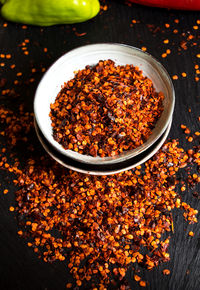 High angle view of chili pepper in bowls on table