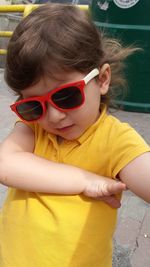 Close-up of cute boy wearing sunglasses