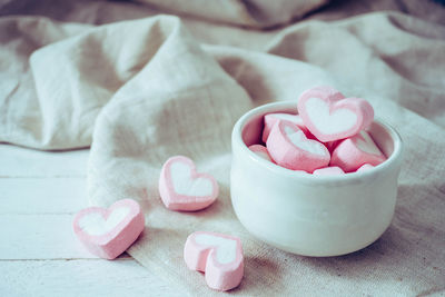Close-up of pink roses on table