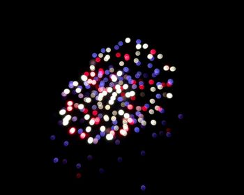 Defocused image of illuminated christmas lights at night