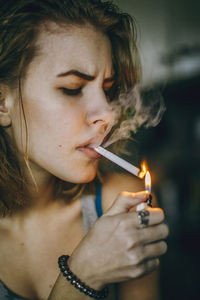 Young woman smoking cigarette