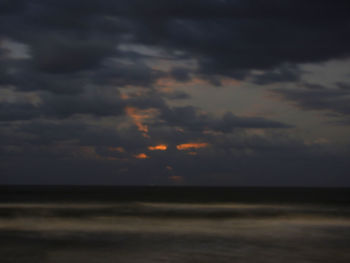 Scenic view of sea against dramatic sky