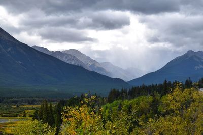 Scenic view of mountains against cloudy sky