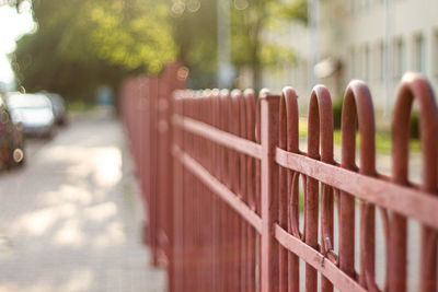 Close-up of metal fence against blurred background