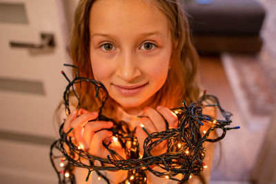 Girl and christmas garland.