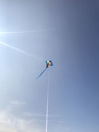 Low angle view of kite flying in sky