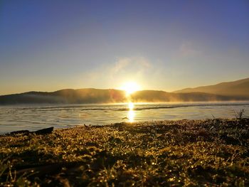 Scenic view of sea against sky during sunset