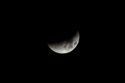 Low angle view of moon against sky at night