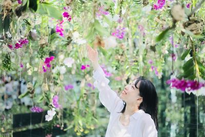 Young woman holding flowers