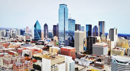 Modern buildings in city against sky