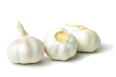 Close-up of pumpkins against white background