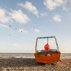 Man on beach against sky