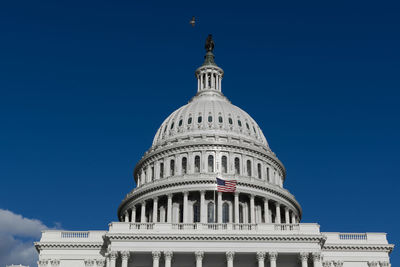 Low angle view of building against blue sky