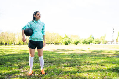 Full length of woman standing on field