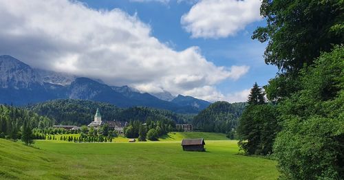 Scenic view of landscape and mountains against sky