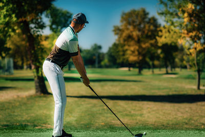 Playing golf. golfer getting ready for the shot