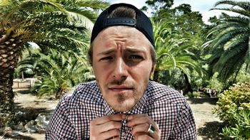 Close-up portrait of young man wearing cap