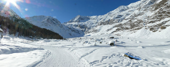 Scenic view of snowcapped mountains against sky