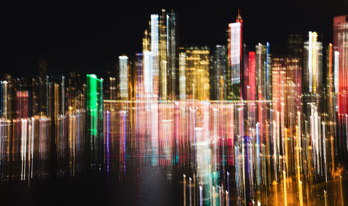 Illuminated modern buildings in city at night