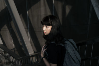 Portrait of woman standing at home