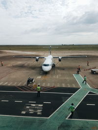 High angle view of people at airport runway