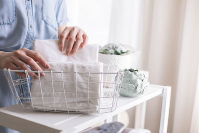 Midsection of man working in wicker basket