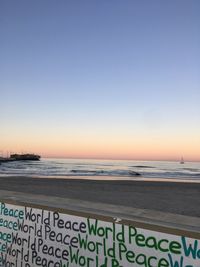 Scenic view of sea against clear sky during sunset