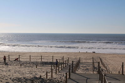 Scenic view of beach against clear sky