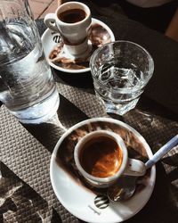 High angle view of coffee cups on table