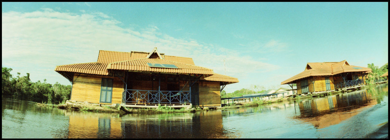 BUILDING AGAINST SKY WITH WATERFRONT