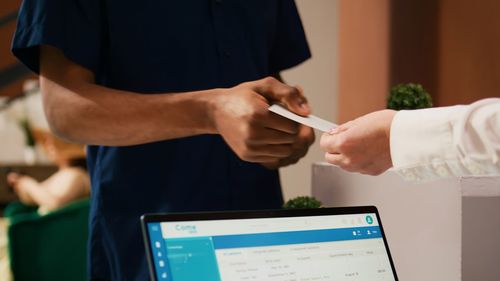 Midsection of man working in office