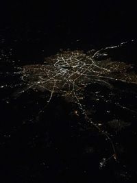 Aerial view of illuminated city at night